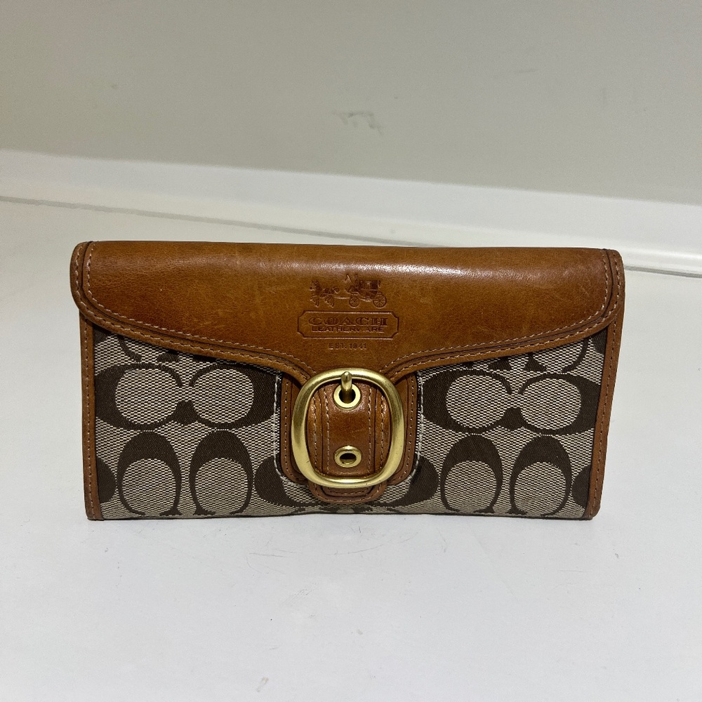 Brown and tan large trifold signature coach wallet